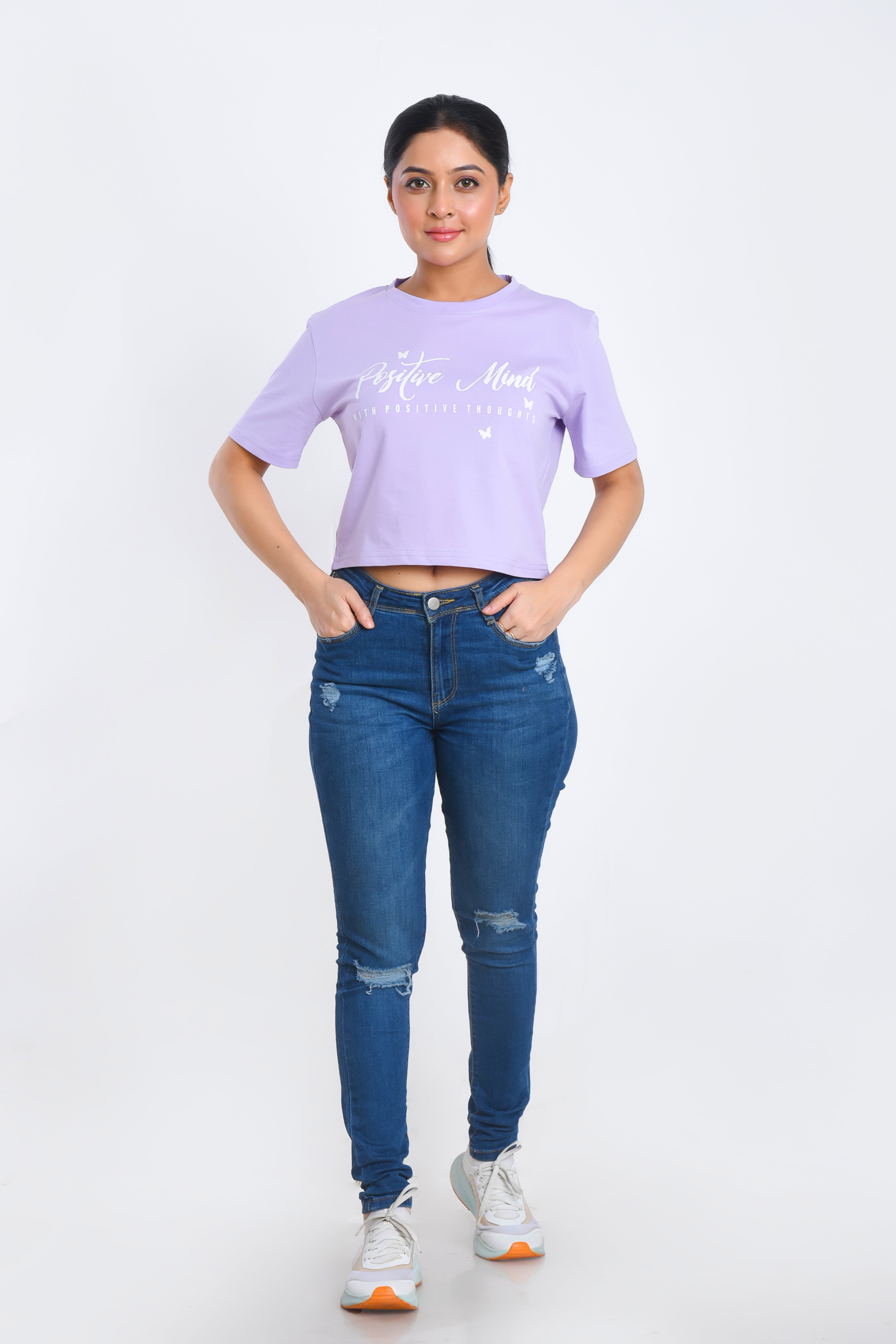 Model Posing in Lavender Printed Crop Top paired with jeans