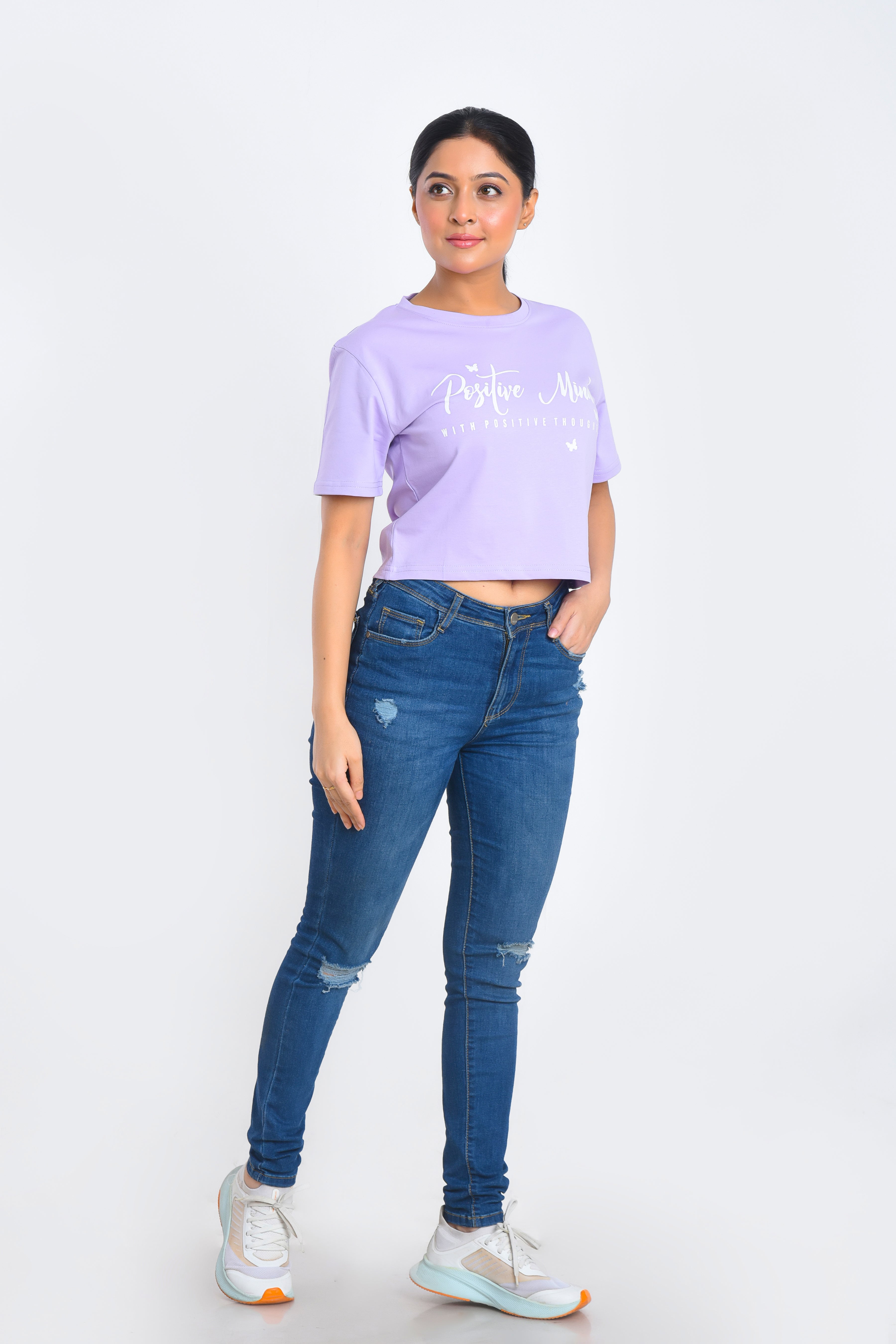 Model Posing in Lavender Printed Crop Top paired with jeans