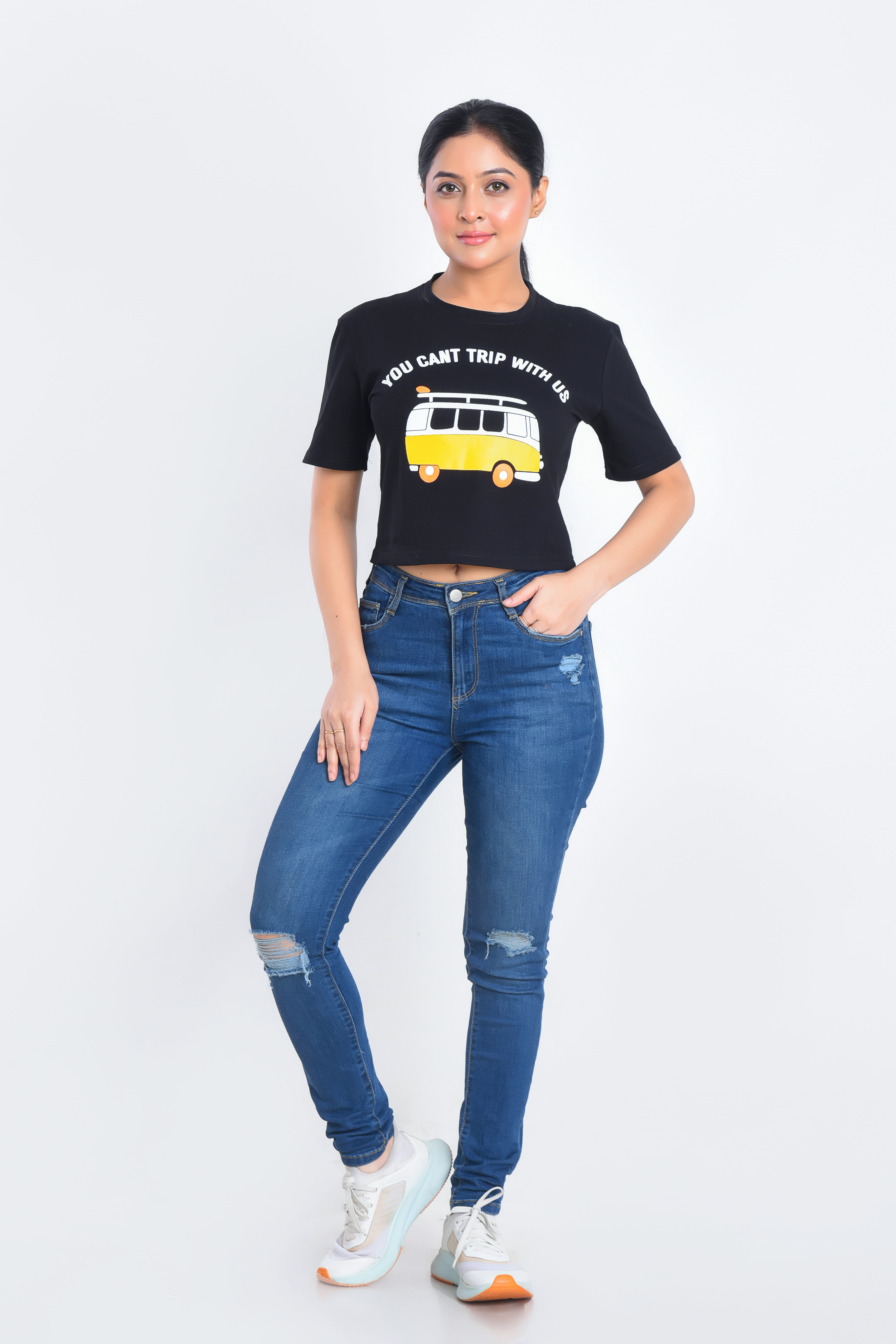 Model Posing in Black Printed Crop Top paired with jeans
